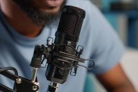 close up of man talking in to microphone
